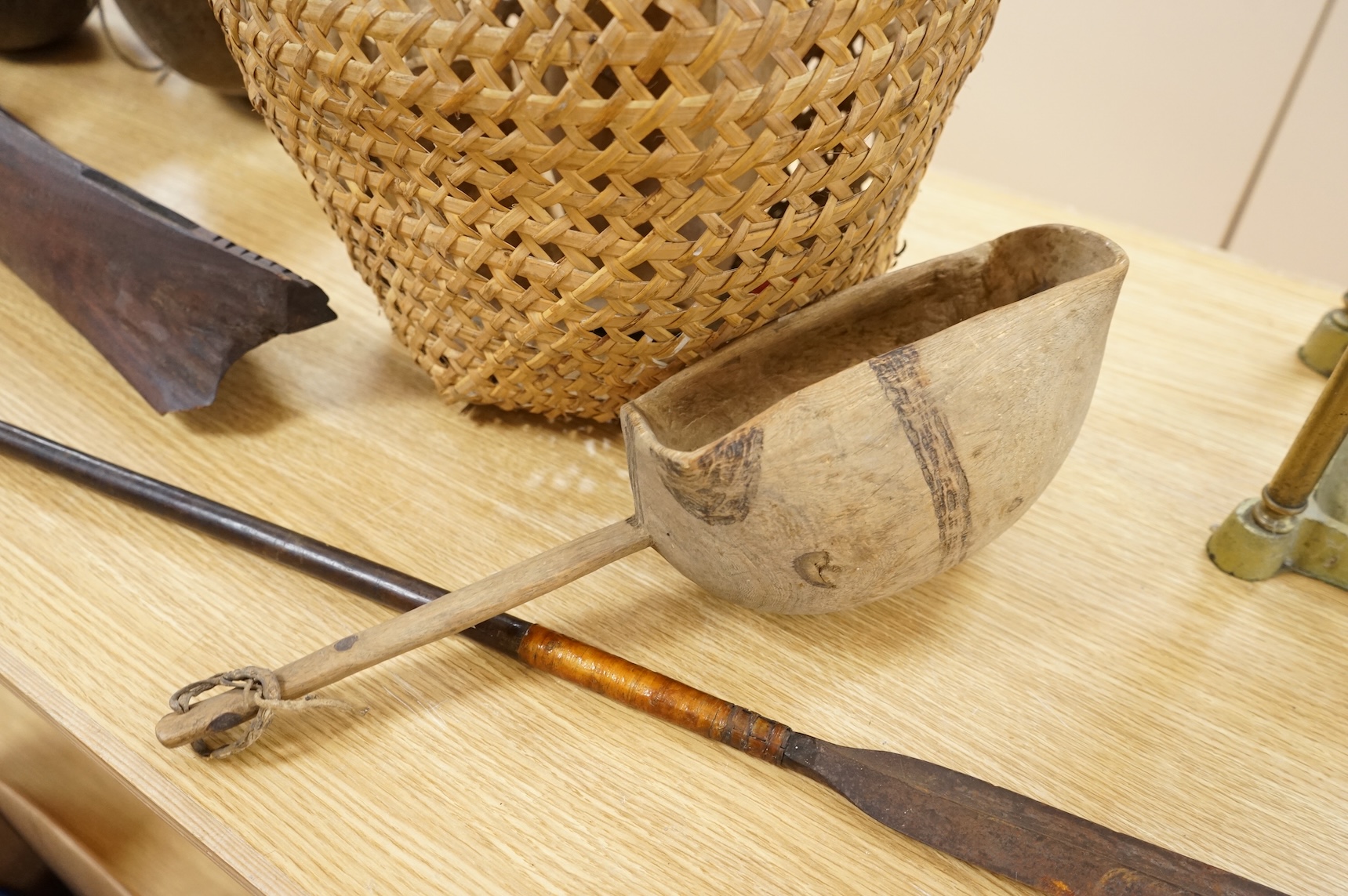 Tribal interest; A collection of various African carvings, a basket and spear